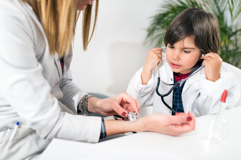 Little Boy Playing a Doctor in Doctor’s Office